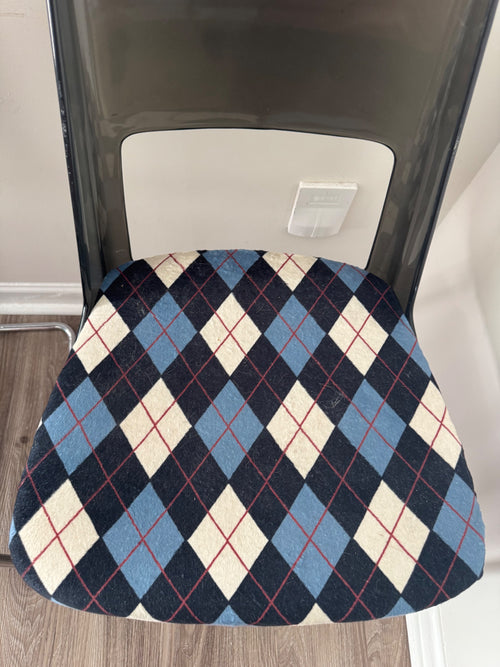 Single chair overhead view showing argyle patterned seat cushion in navy, cream, and light blue with red diamond outlines