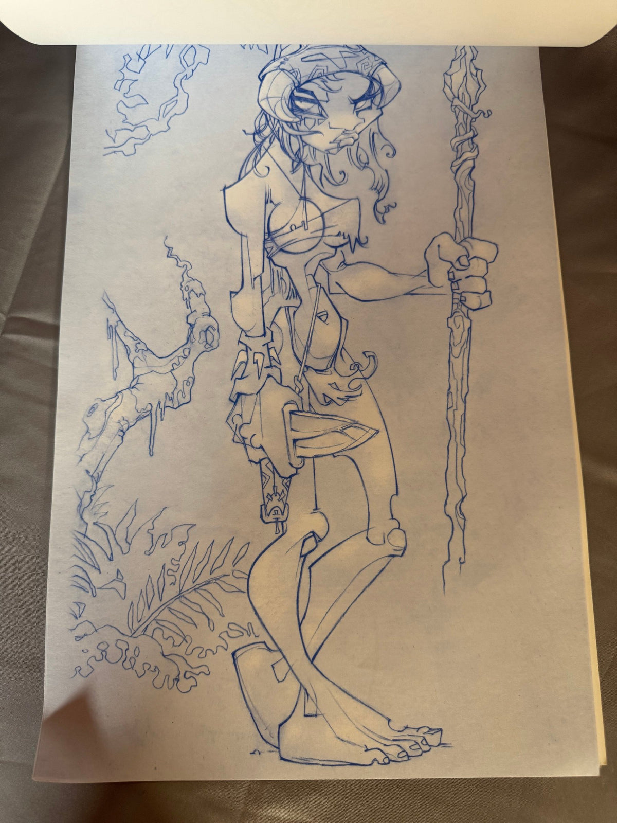 Blue-pencil figure drawing with plants