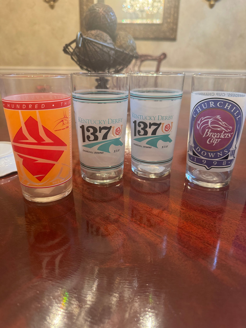 Four glasses in a row: Kentucky Derby 133rd 2007, two 137th 2011 glasses, and a 1998 Breeders' Cup Churchill Downs glass