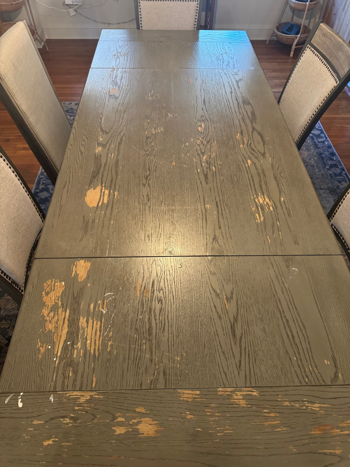 Top of the table showing heavy wear and lifting finish