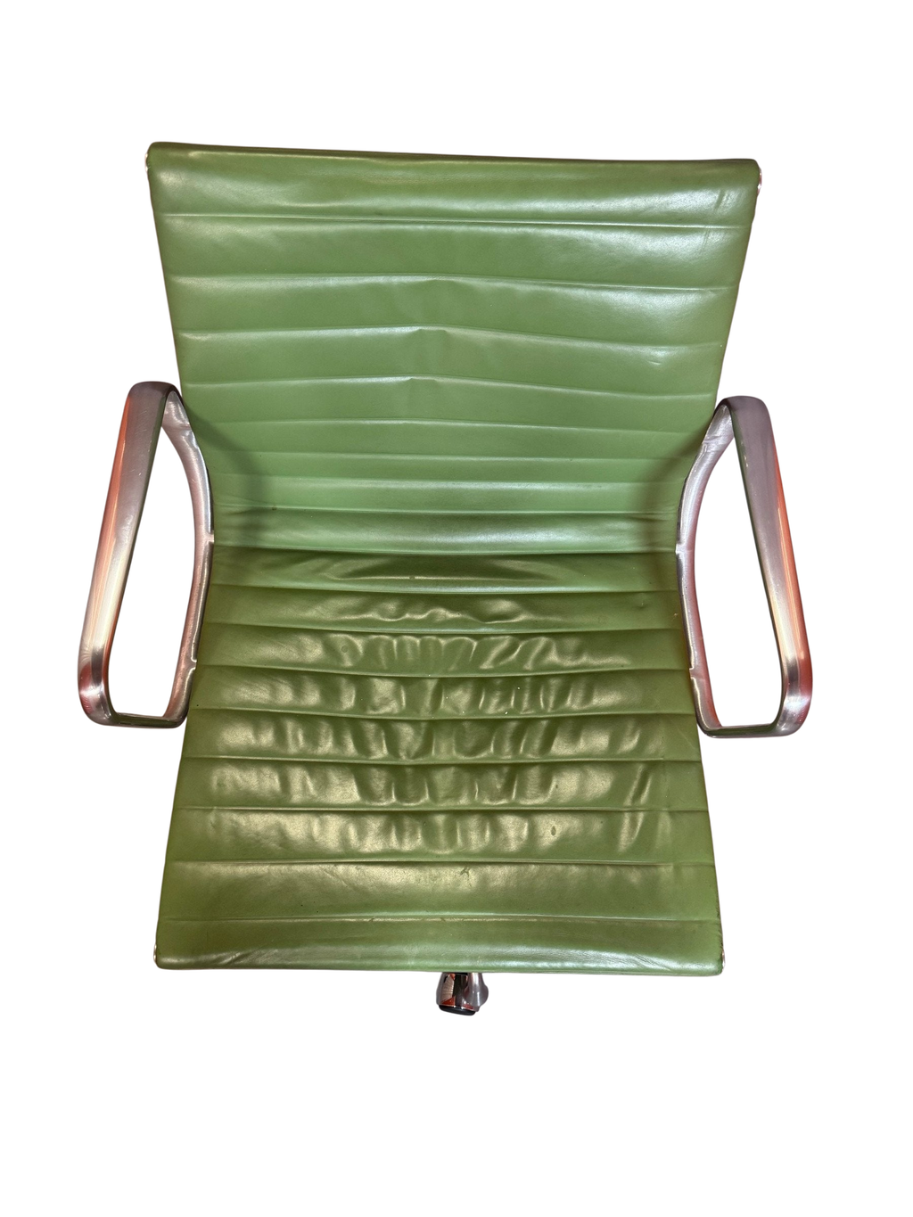 Green ribbed chair seen from above showing seat creasing