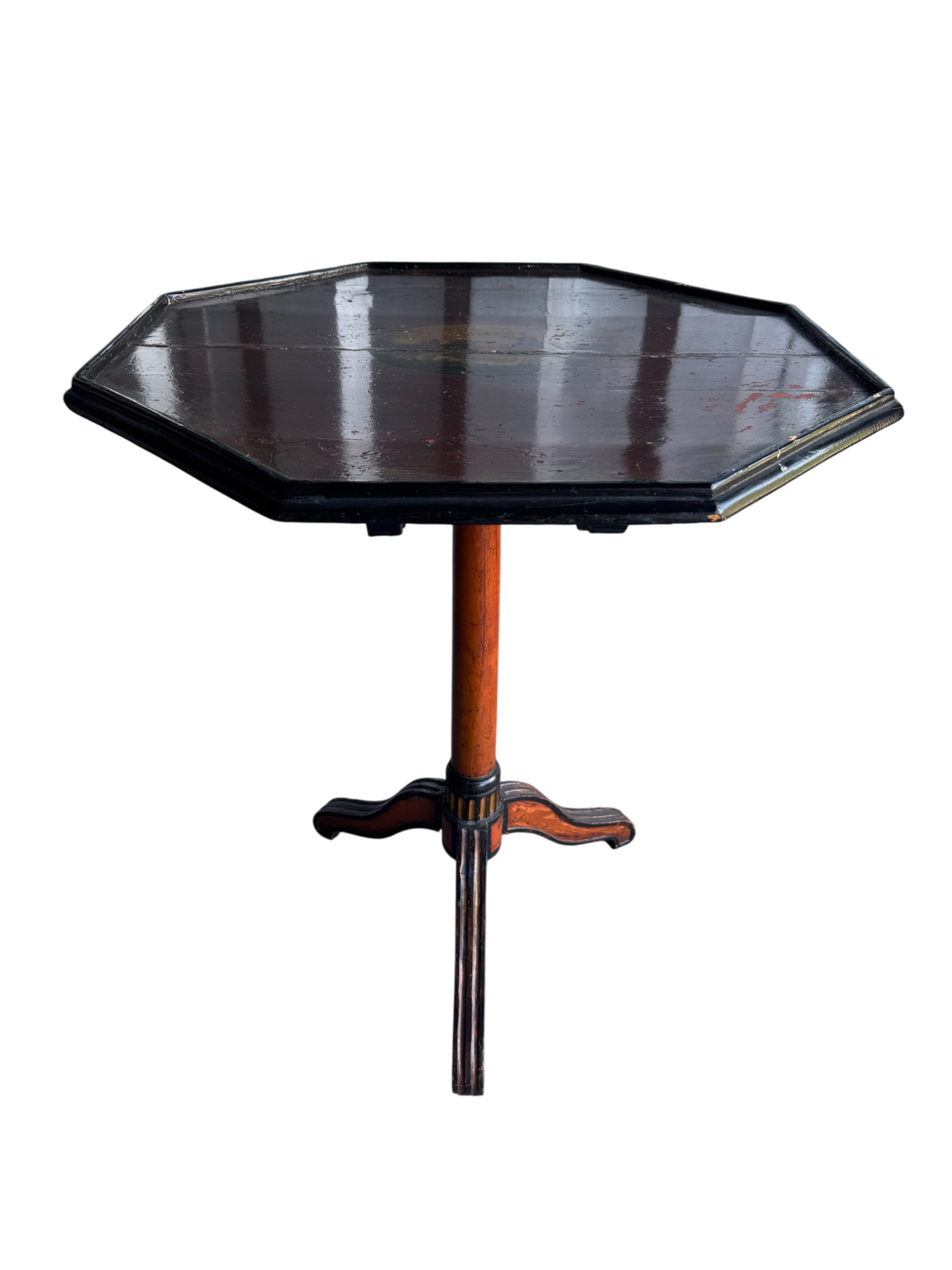 Octagonal lacquered table top with black finish and decorative landscape medallion, viewed from above