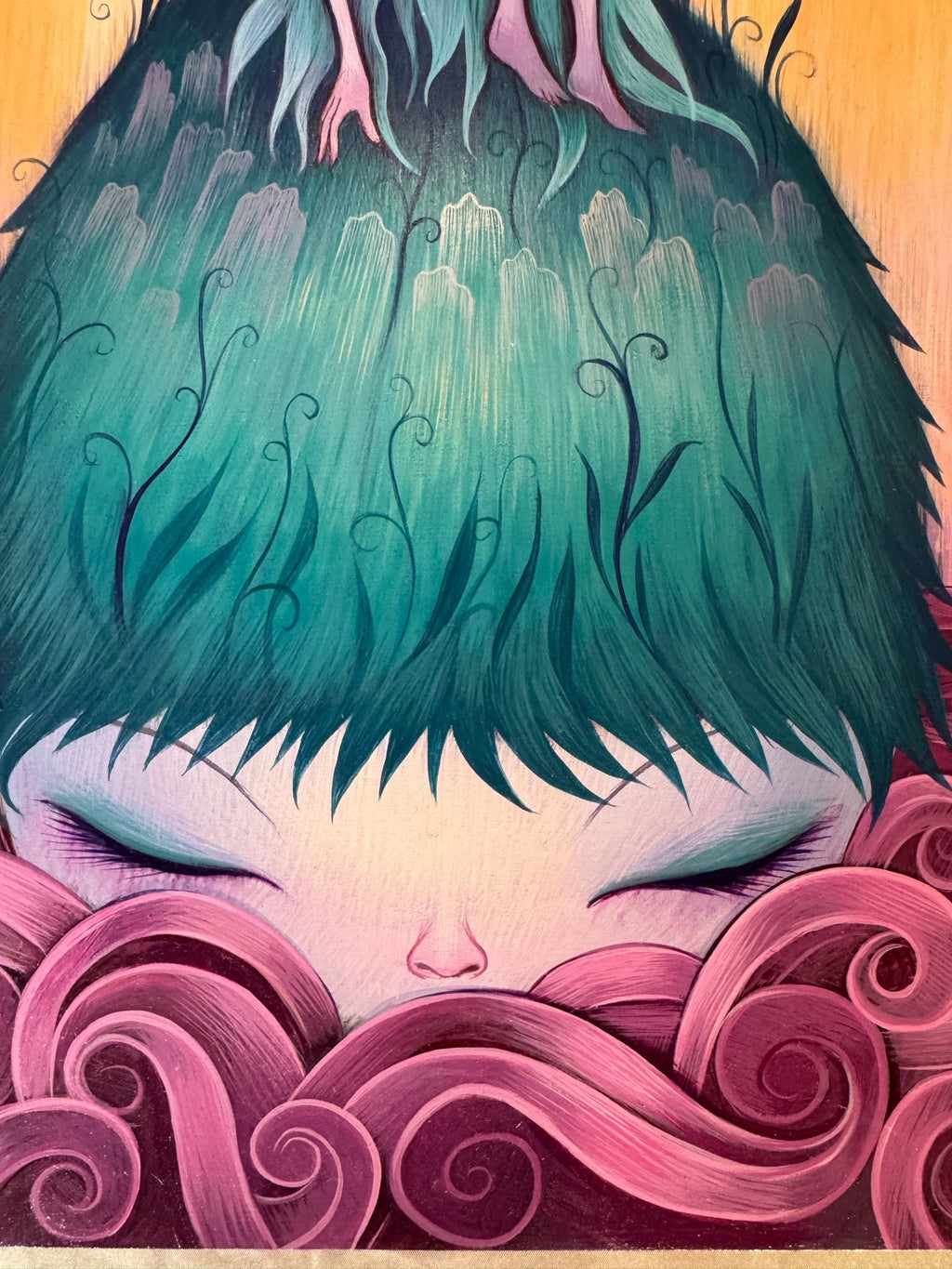 Detail of the sleeping face and pink swirled hair