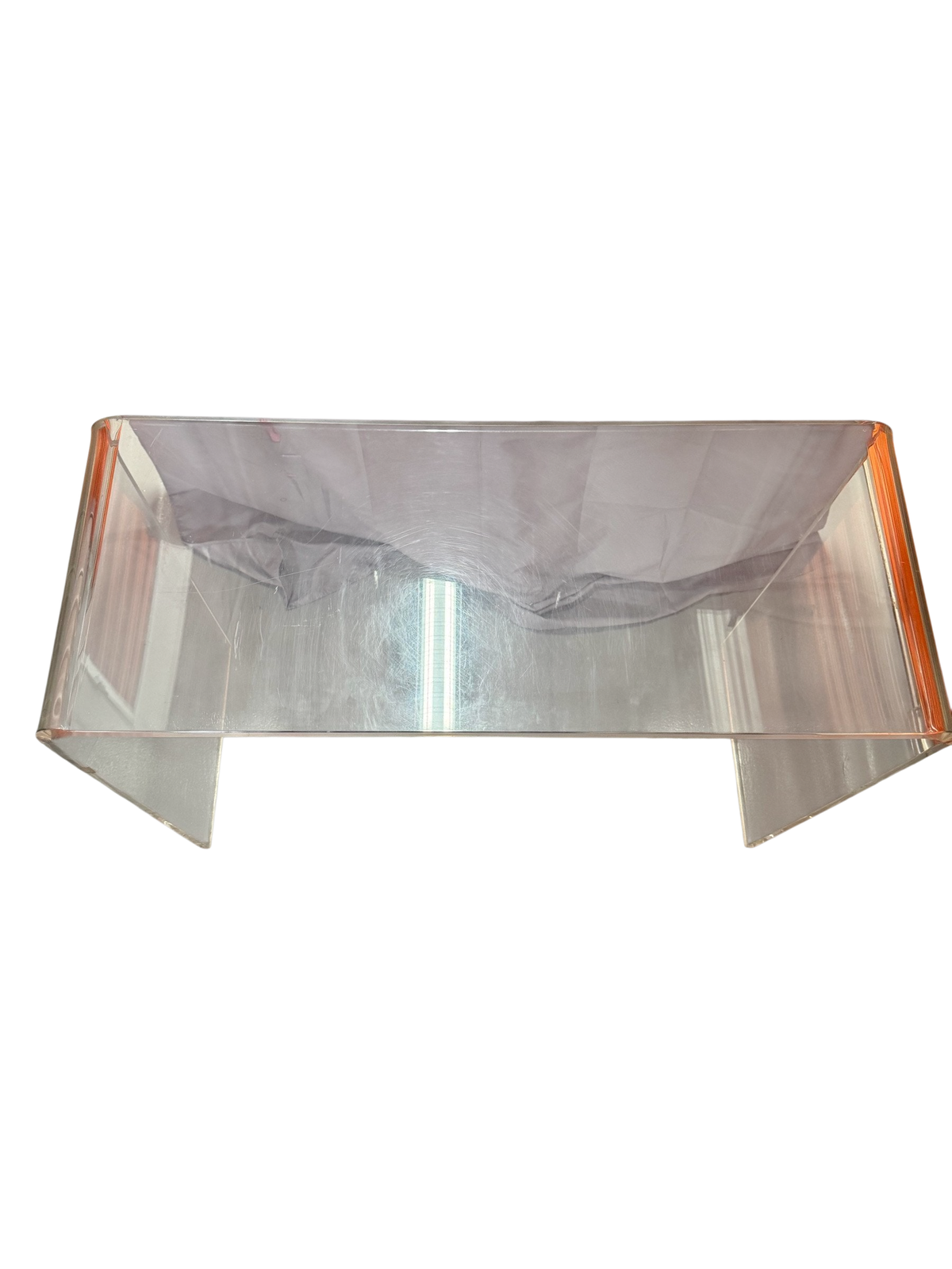 Top of the acrylic table showing surface scratches