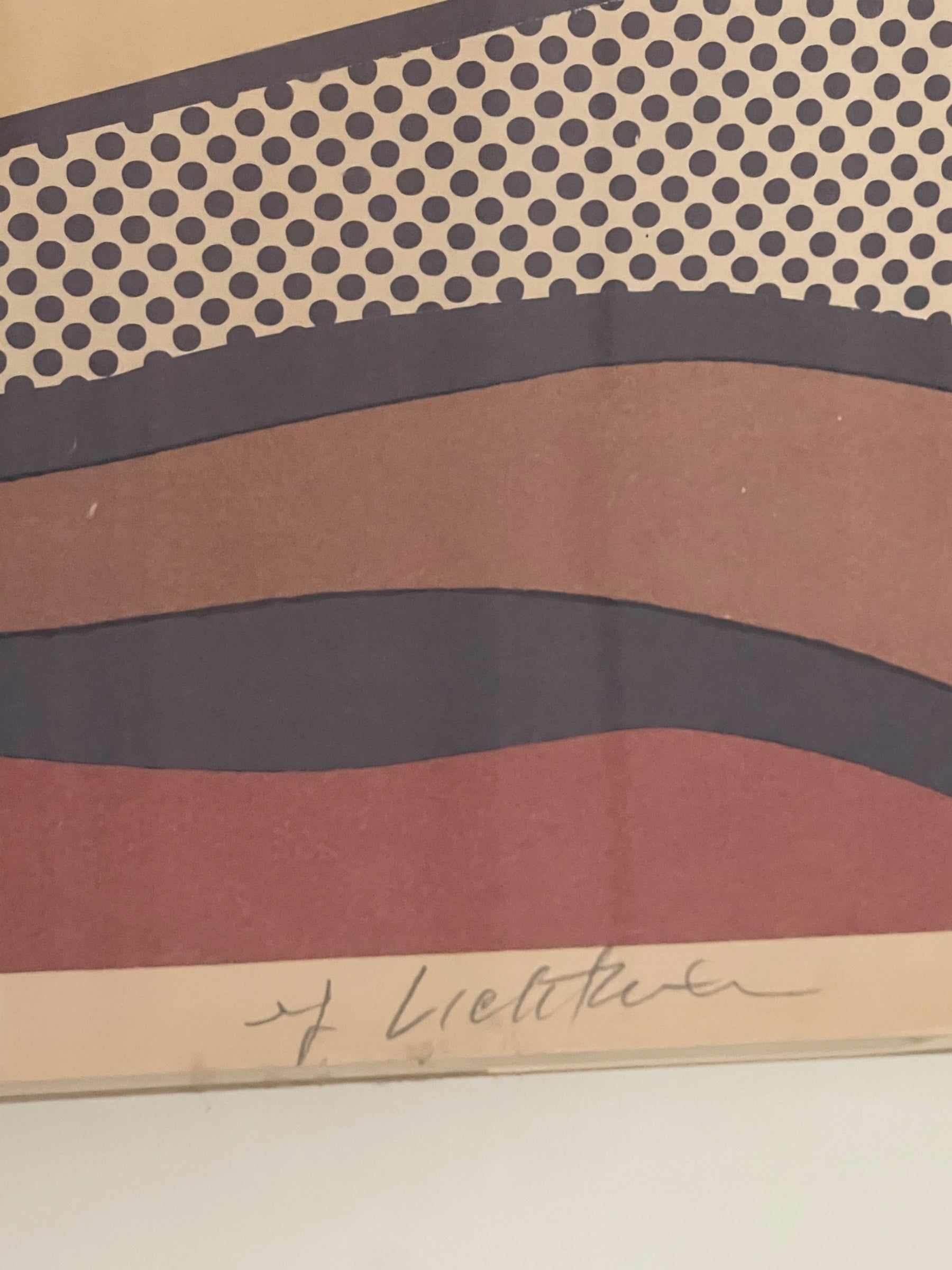 Close-up of lower portion displaying artist signature and wavy landscape bands in rust, navy, and tan colors