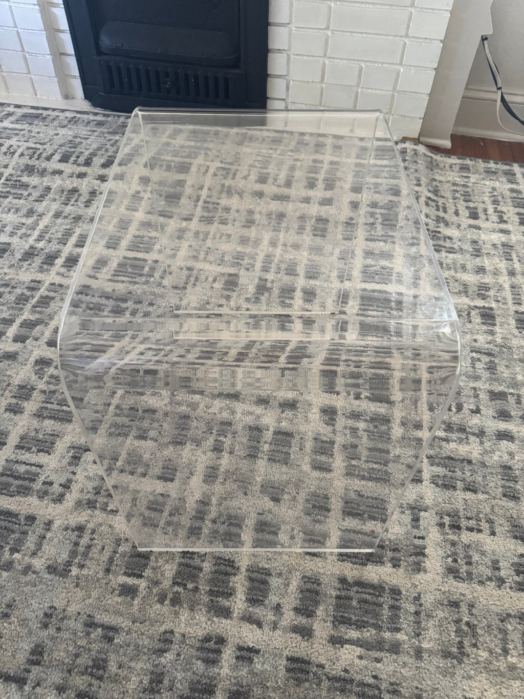 Angled view of the acrylic coffee table