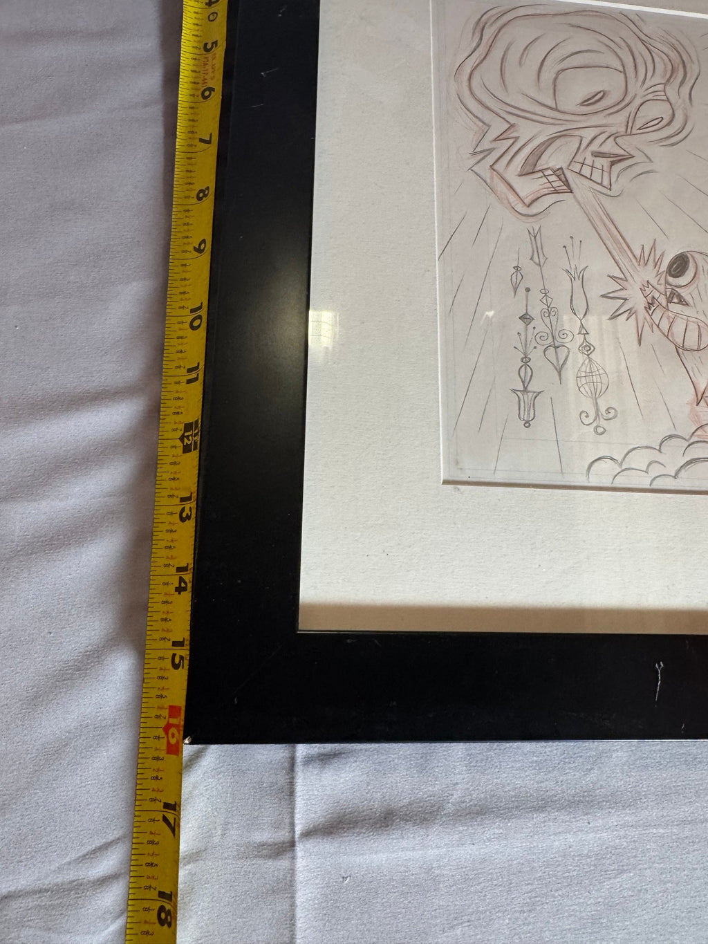Ruler held at the frame corner showing approximate size