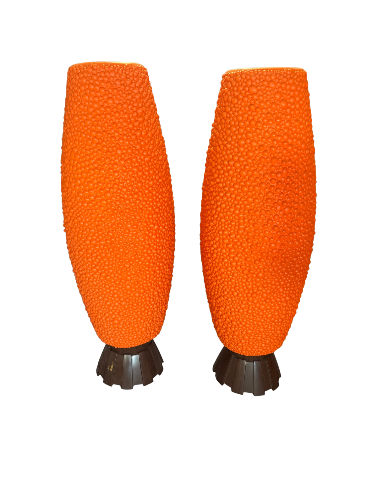 Pair of orange textured bean-shape table lamps on brown bases, front view