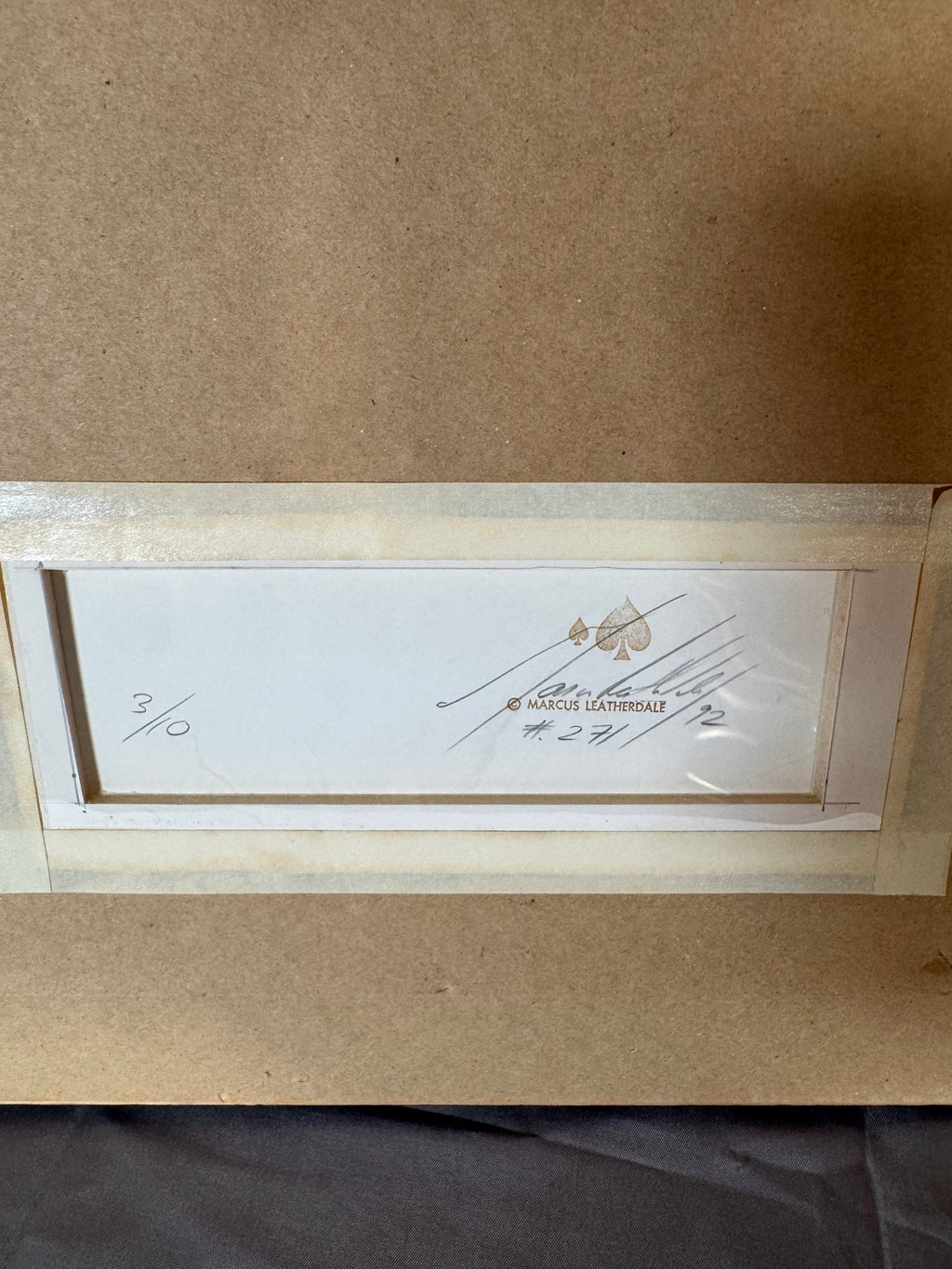 Back with the stamp, signature and 3/10 notation