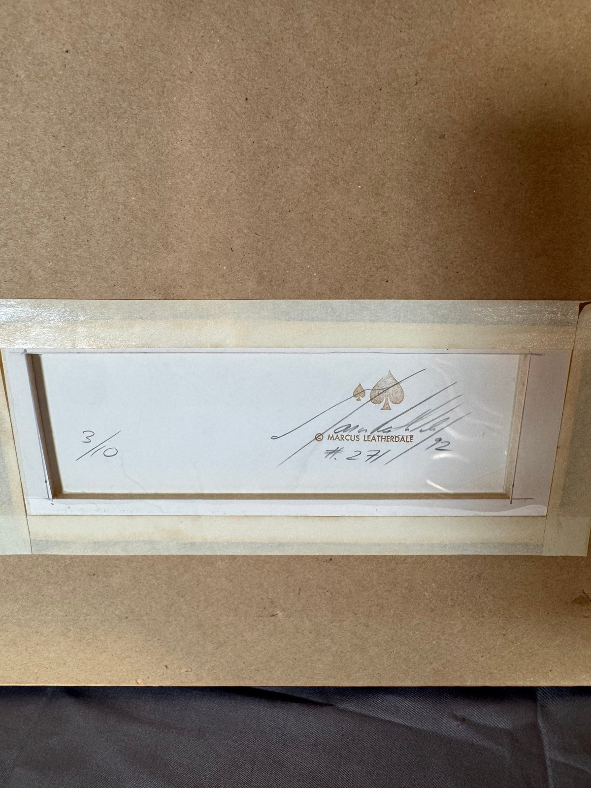 Back with the stamp, signature and 3/10 notation