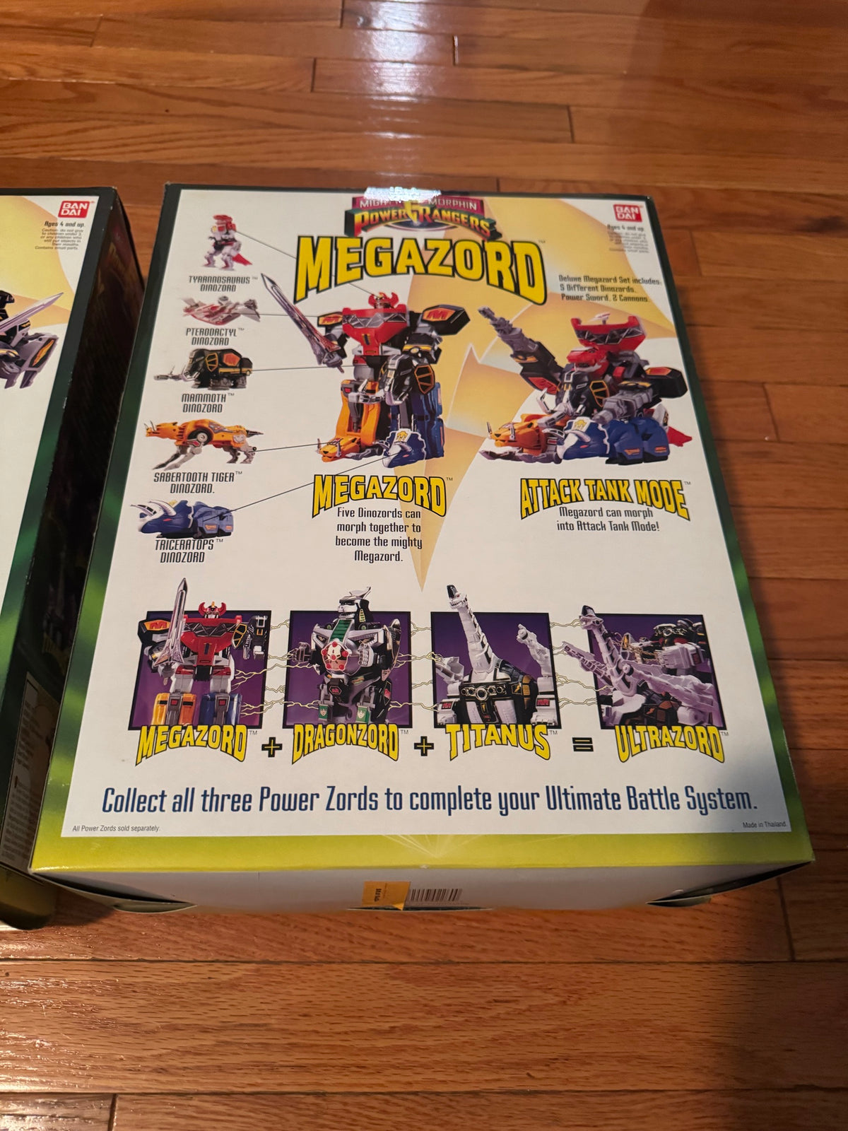 Back of Megazord box showing Dinozord combination artwork
