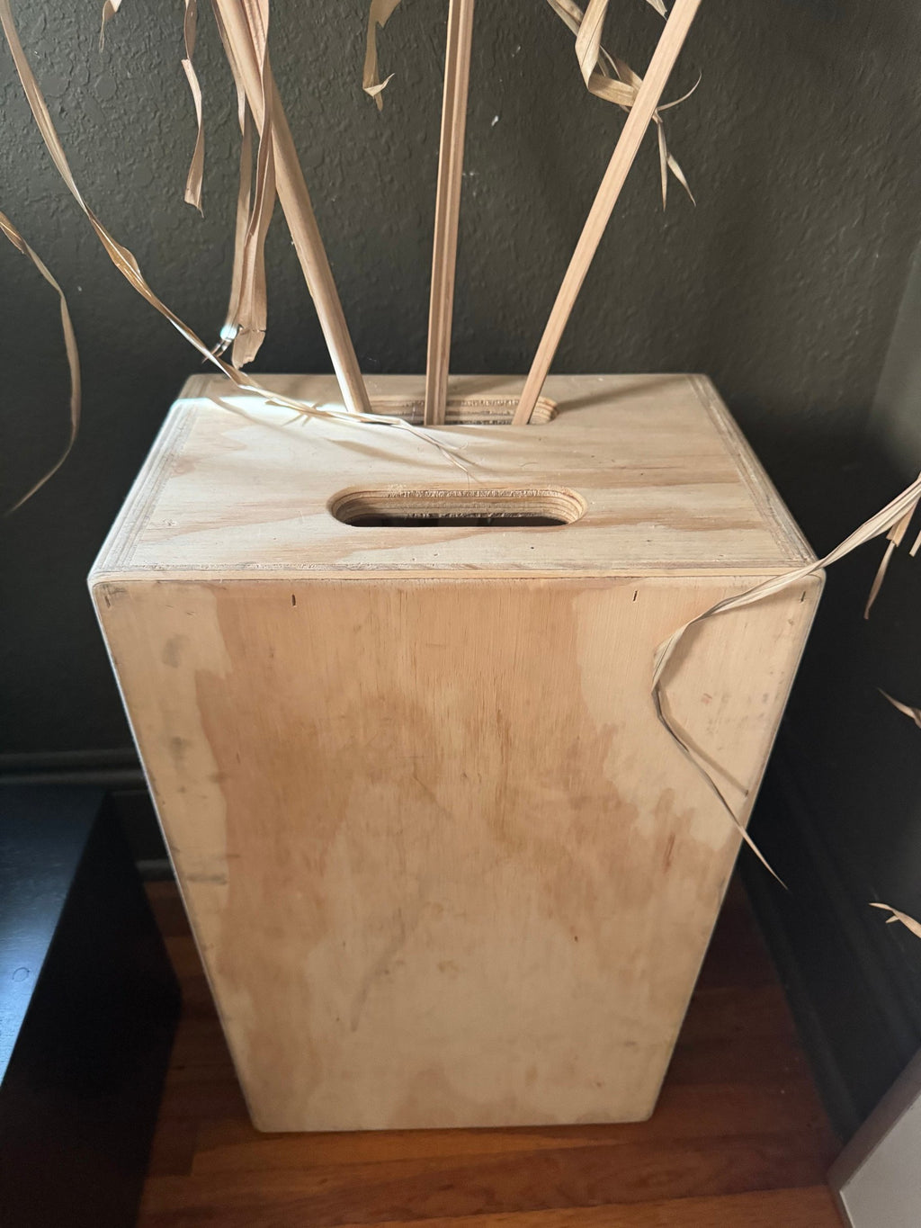 Plywood box holding the dried palms