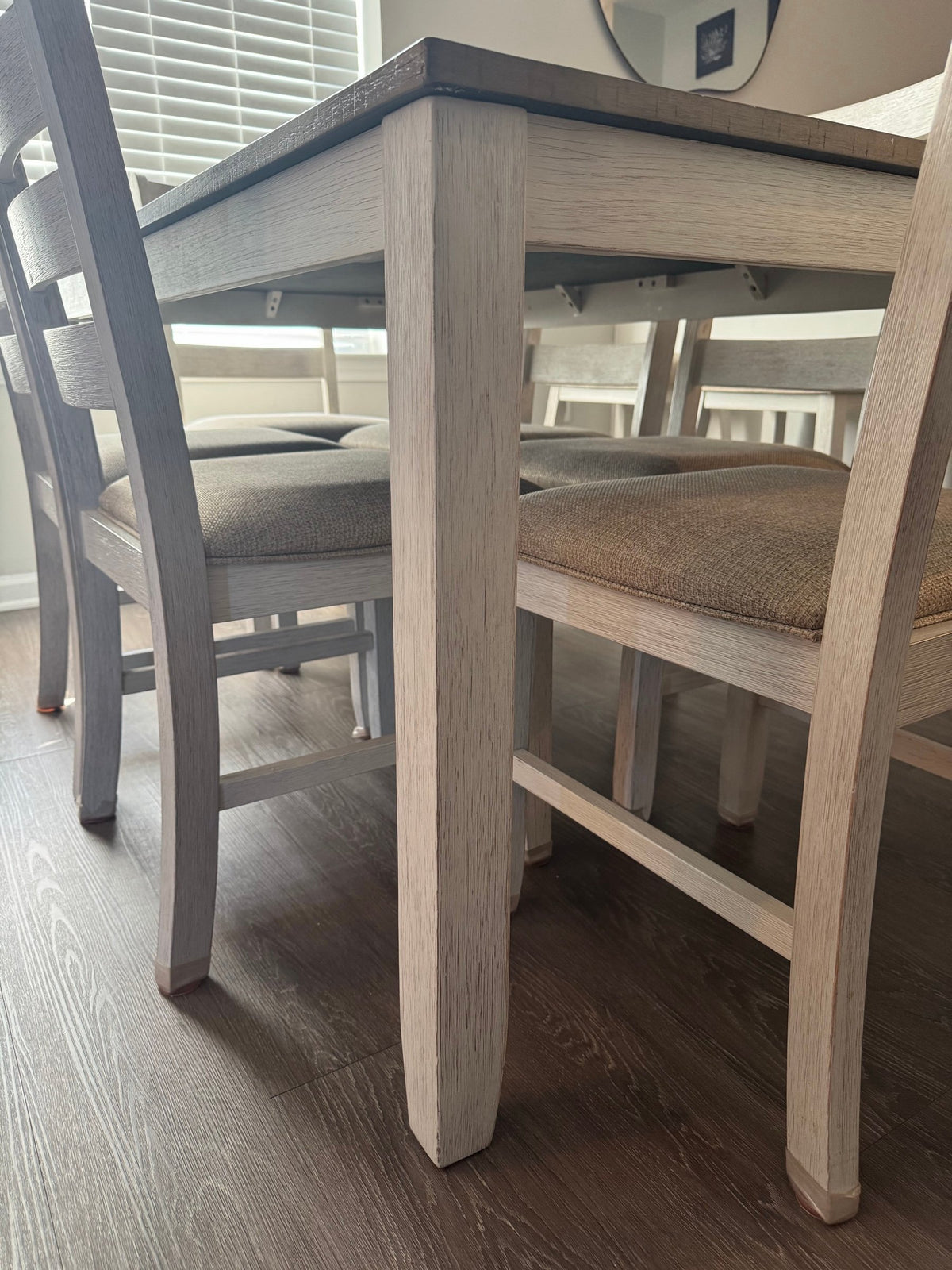 Whitewashed table leg and chair