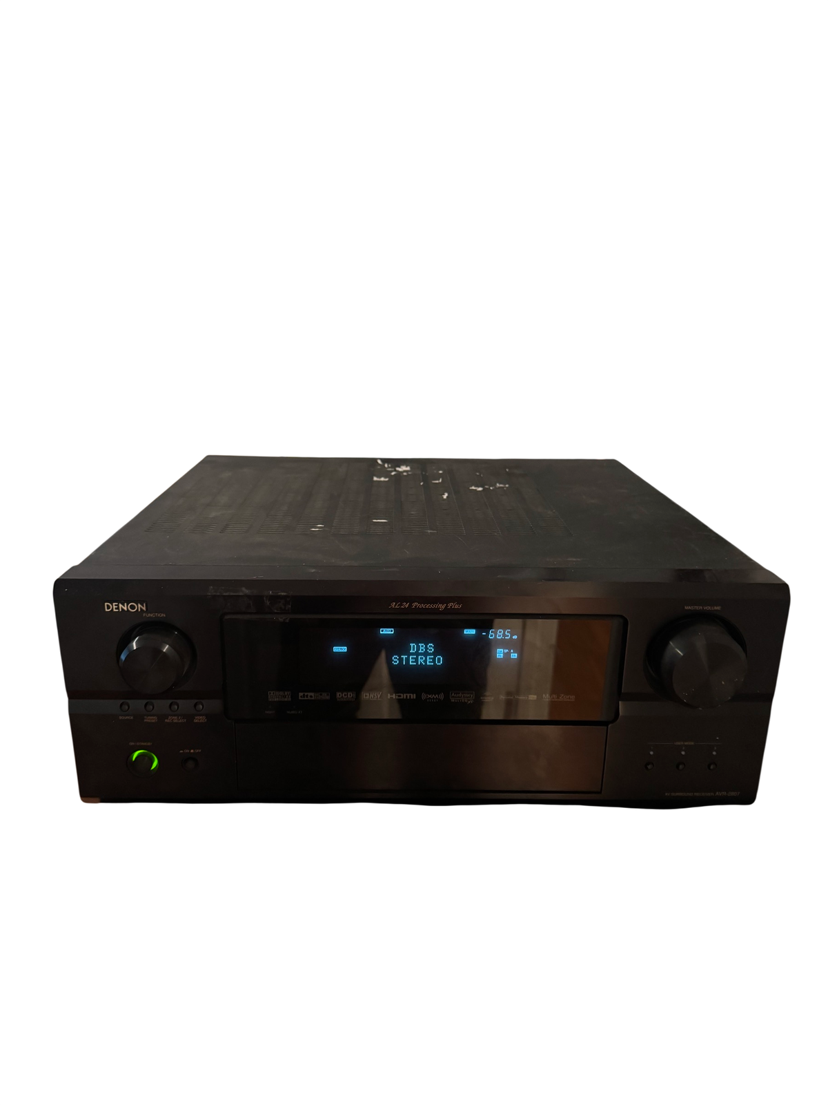 Denon AVR-2807 receiver on a stand with display showing DBS Stereo