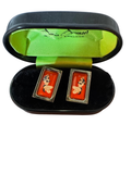 Pin-up cufflinks in their black case