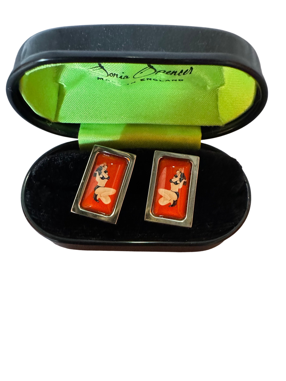 Pin-up cufflinks in their black case