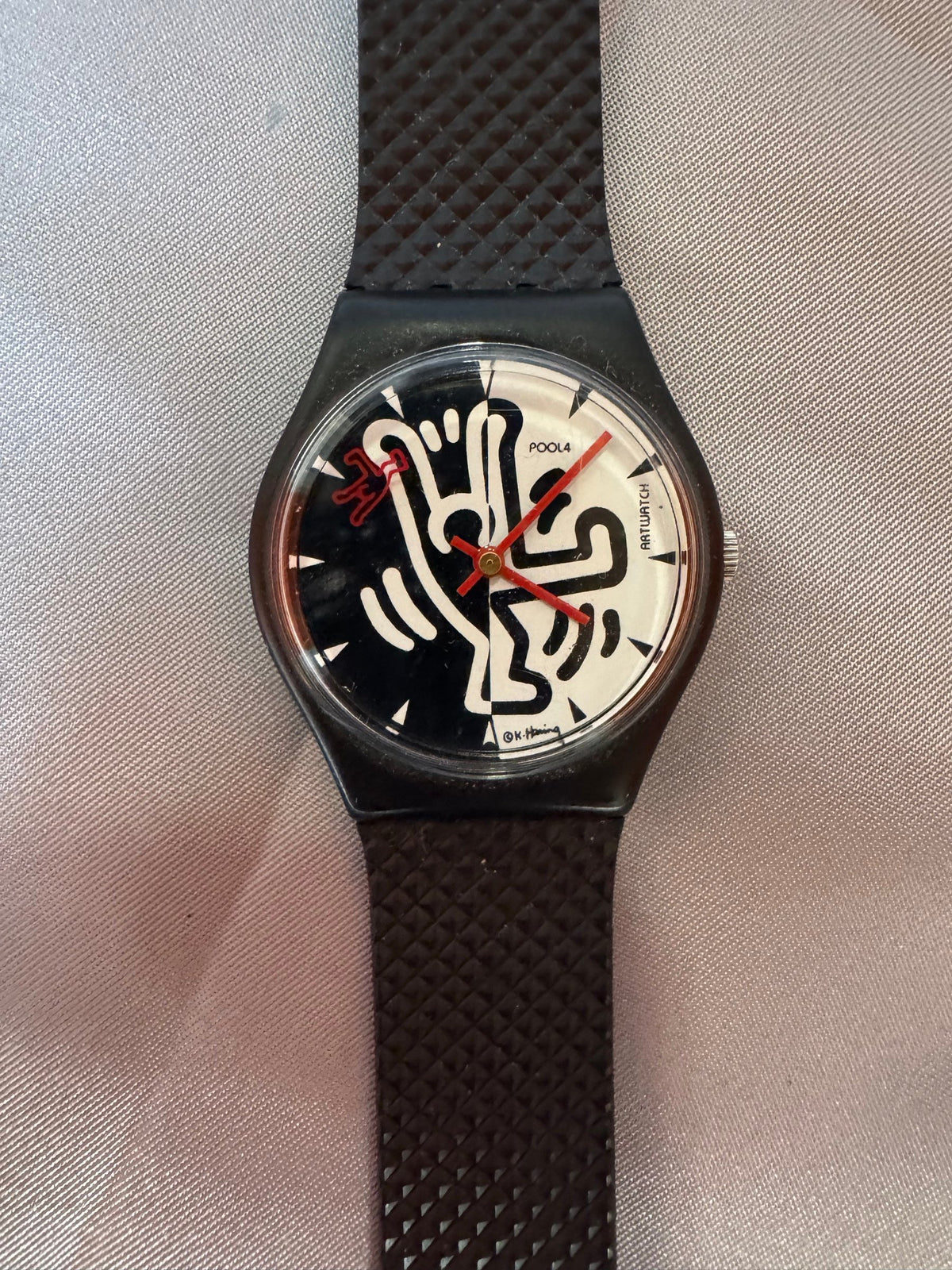 Close view of the black-and-white dancing-figure dial
