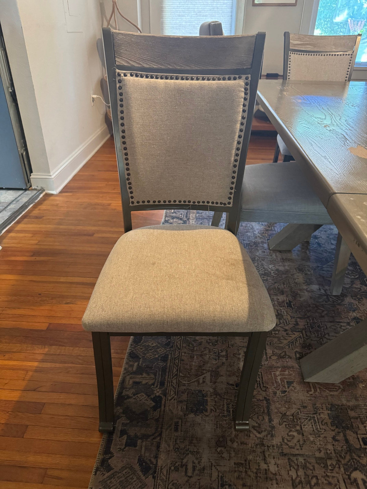 Upholstered nailhead chair, front view