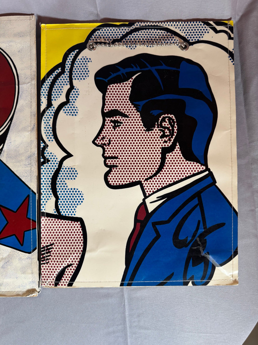 Close view of comic-panel artwork on a bag