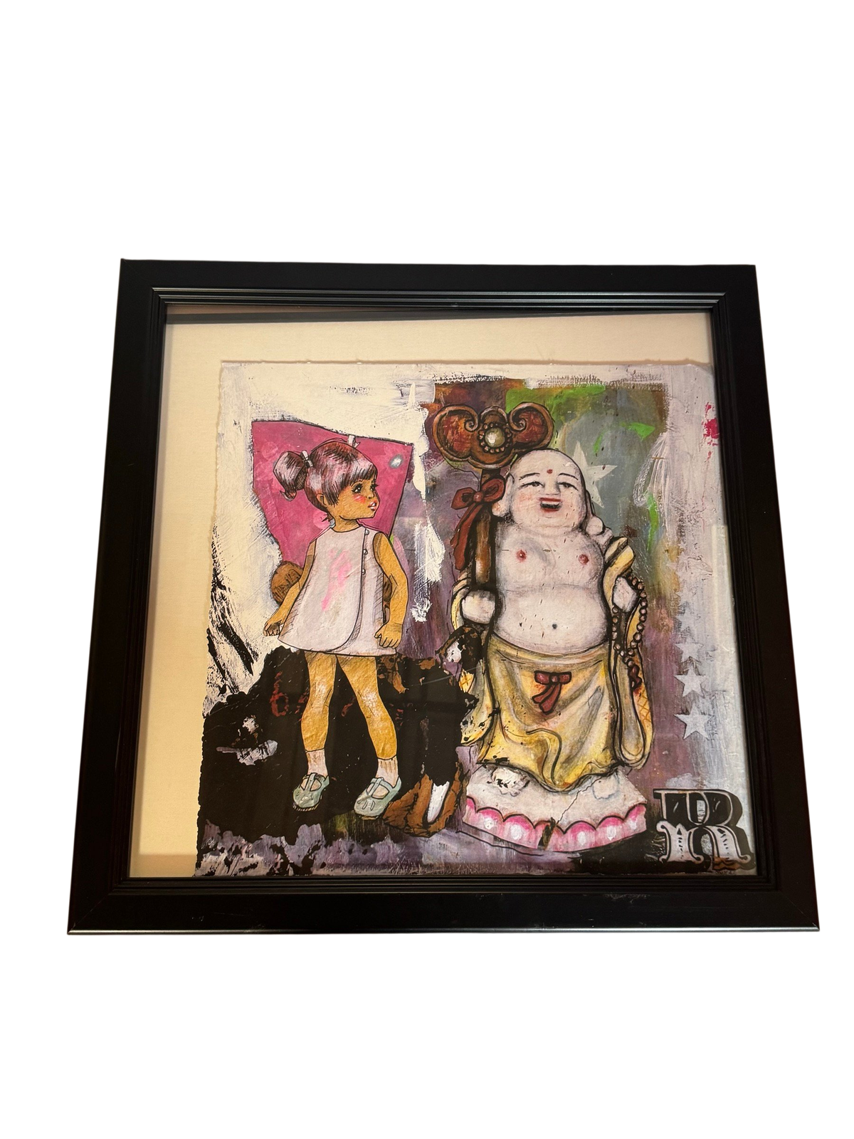 Framed mixed-media collage of a girl and a laughing Buddha figure, straight-on