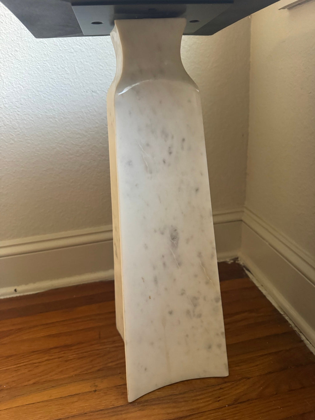 Side view of the marble pedestal base
