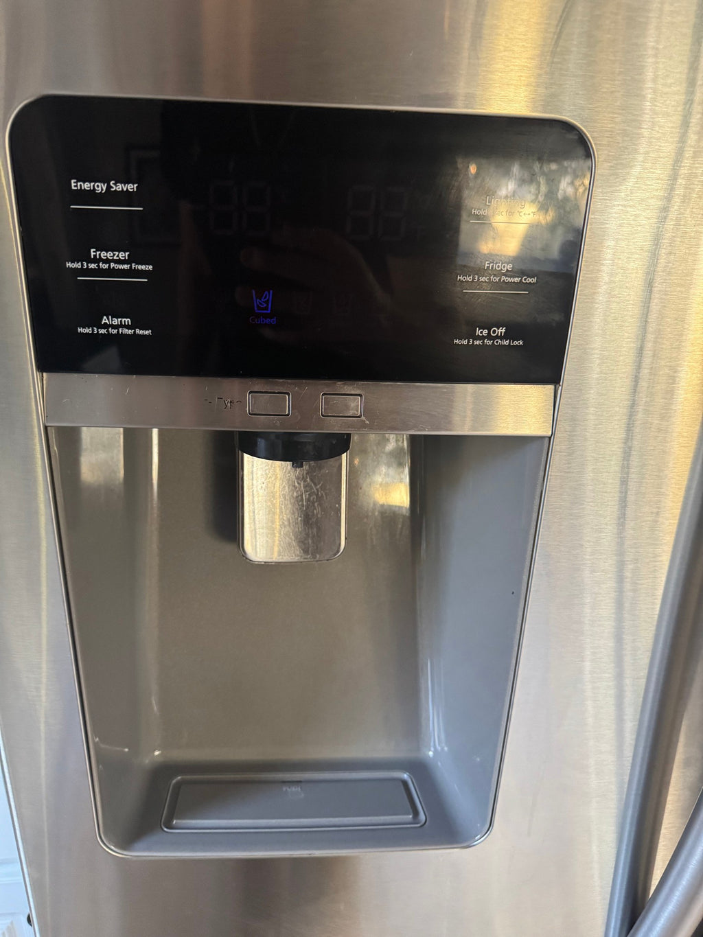 Ice and water dispenser on the door