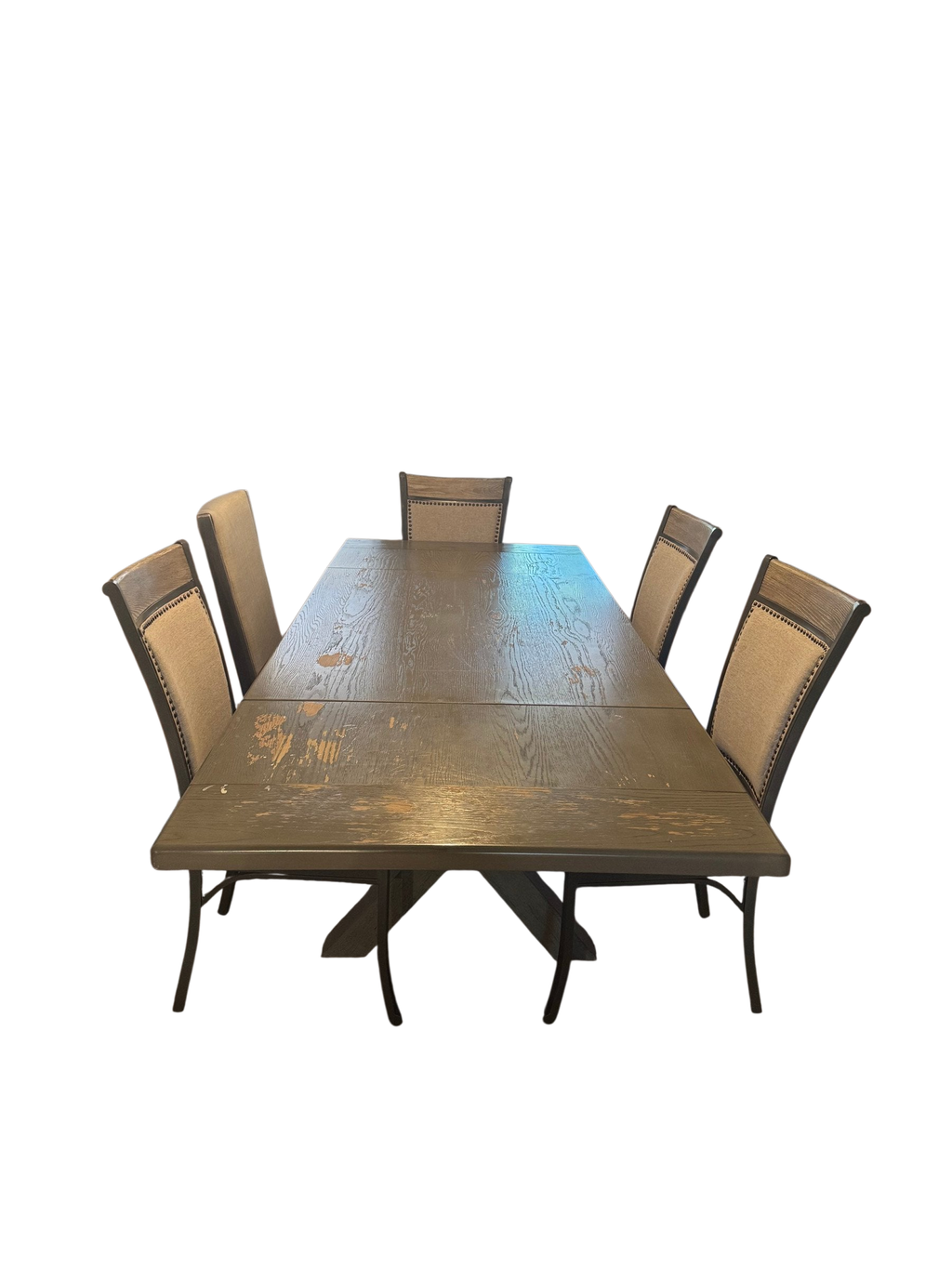 Dining table with six upholstered chairs on a patterned rug