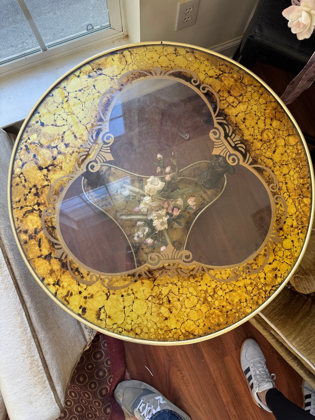 Top view of the gold reverse-painted glass top with a three-lobed inset