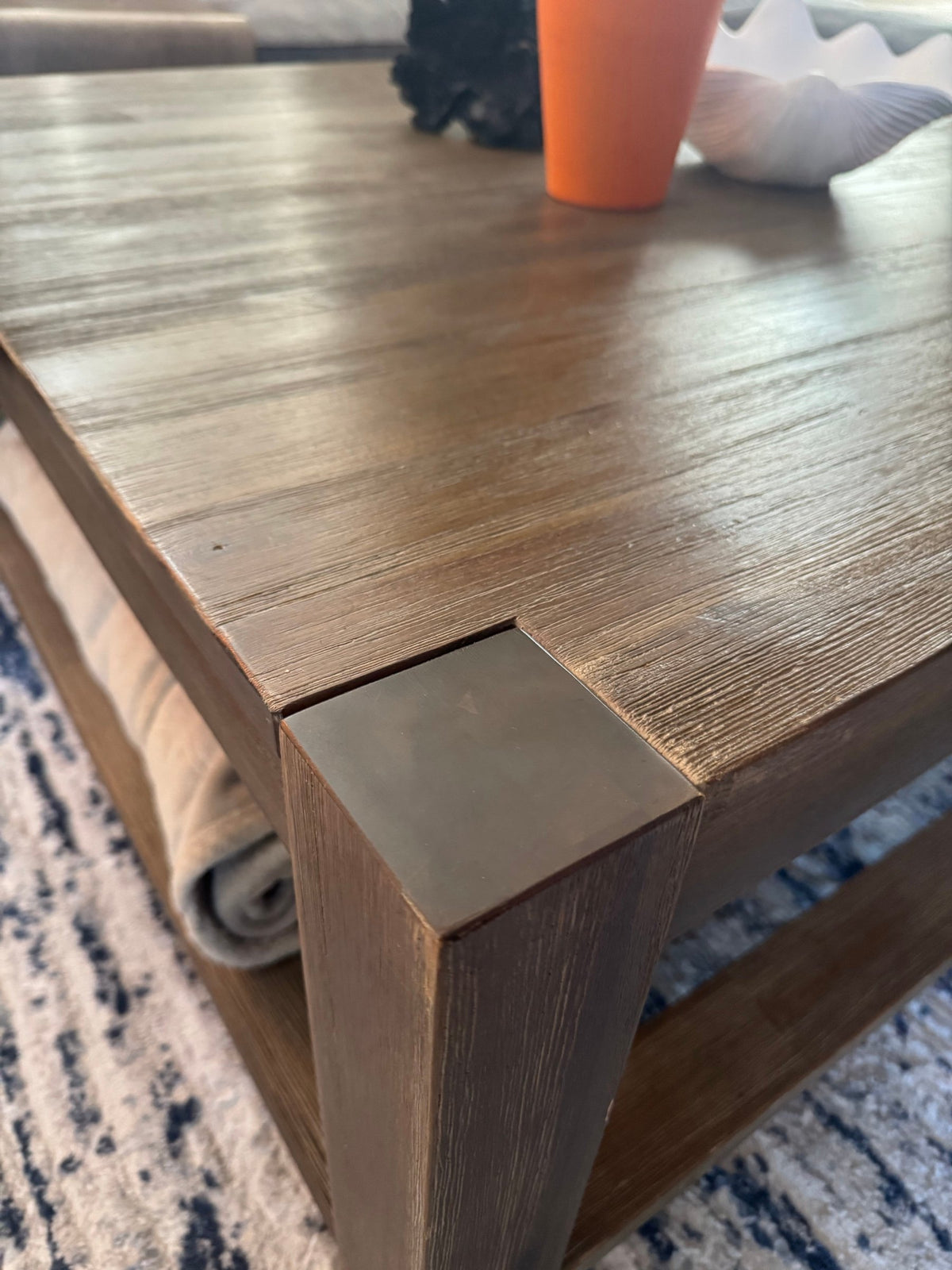 Metal corner cap on the coffee table