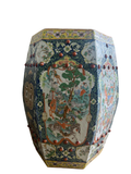 Hexagonal porcelain garden stool with famille rose decoration, dark blue borders and red ceramic spheres, full side view