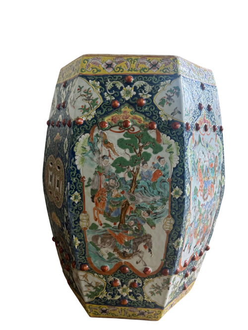 Hexagonal porcelain garden stool with famille rose decoration, dark blue borders and red ceramic spheres, full side view