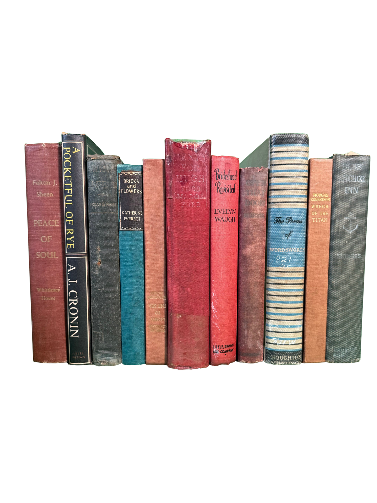 Vintage hardcovers stood spine-out on green cloth, including Henry for Hugh by Ford Madox Ford, Brideshead Revisited by Evelyn Waugh, and Morgan Robertson's Wreck of the Titan and Down to the Sea