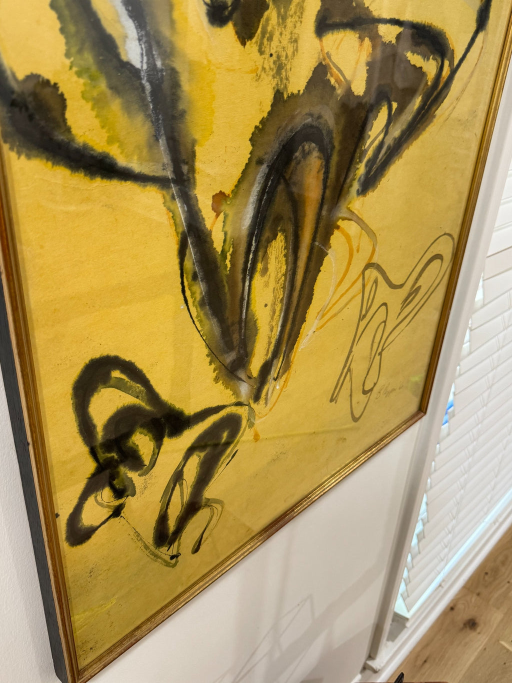 Close-up detail of central abstract forms, black ink strokes and yellow watercolor washes creating organic shapes