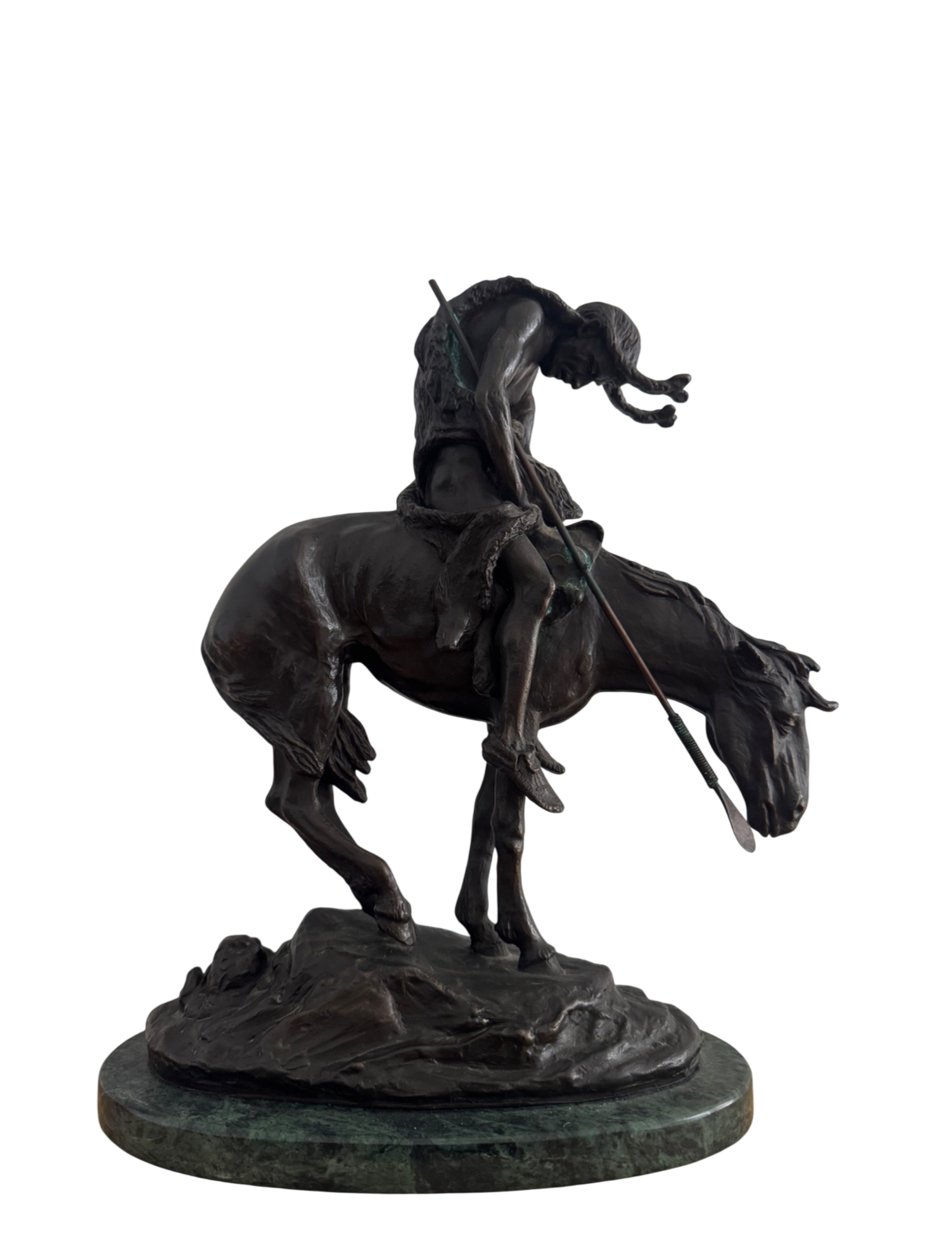 Bronze sculpture of Native American on rearing horse, mounted on green patina base, viewed from front angle