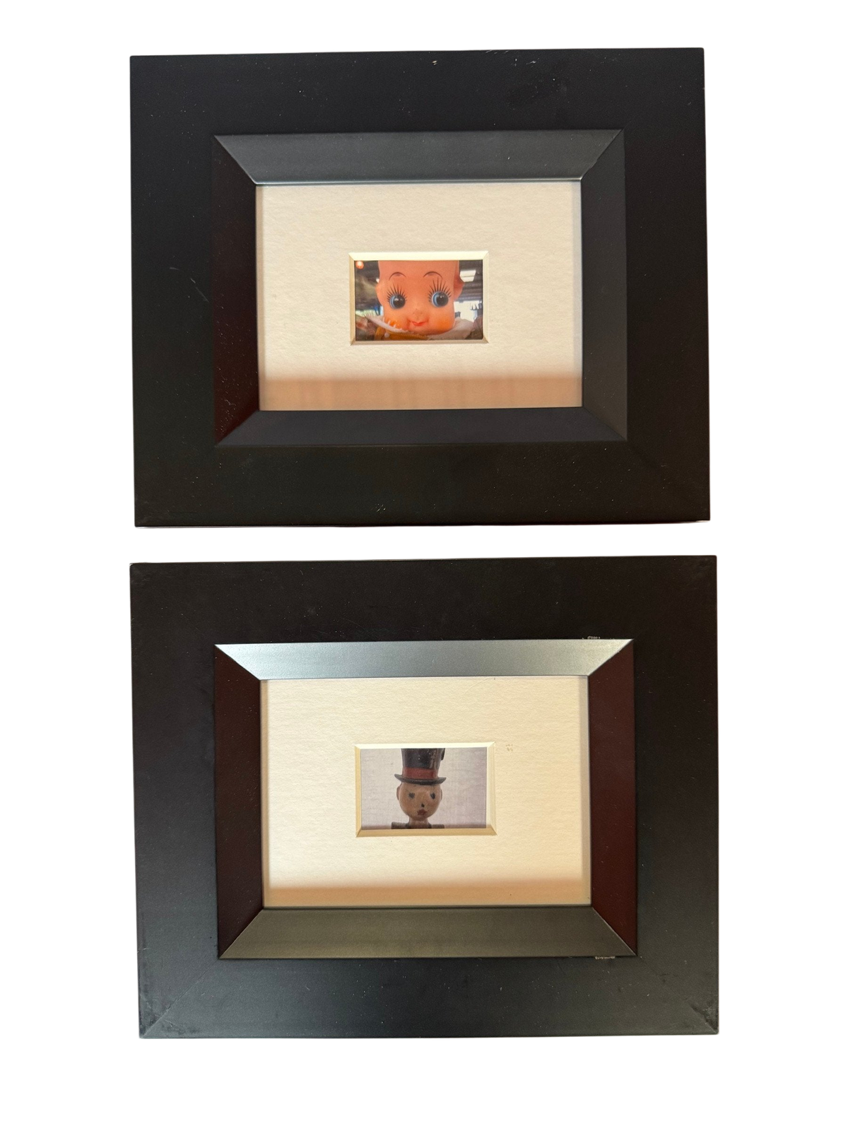 Pair of small framed vintage toy photographs, straight-on