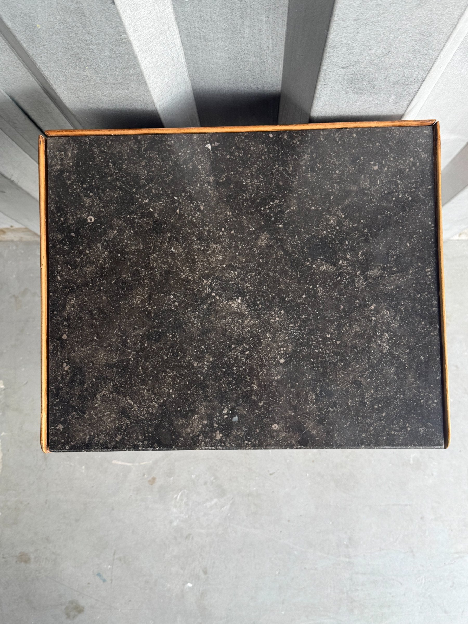 Top surface with dark slate or stone inlay and wood border, viewed from above