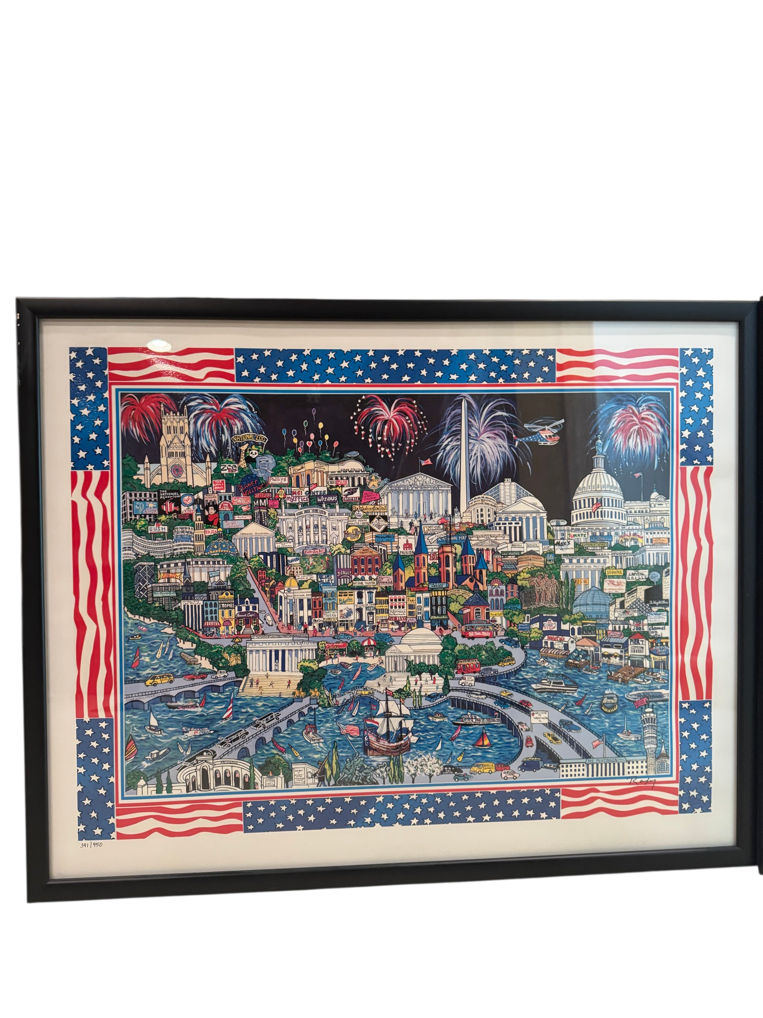 Framed Americana artwork depicting Washington DC landmarks with patriotic flag border, black frame, full view