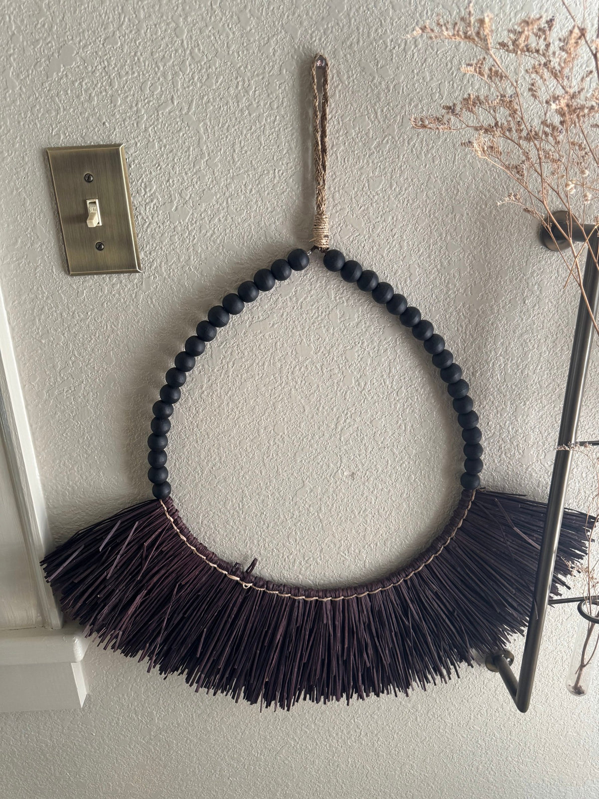Black beaded hoop wall hanging with fringe