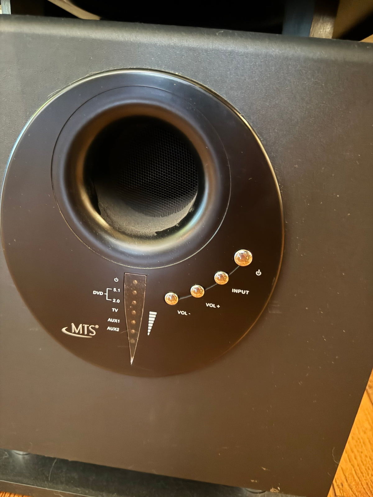 Top control panel with MTS brand logo, input selector buttons, and volume controls with LED indicators