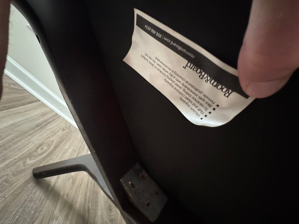 Measurement of seat width using yellow tape measure, showing approximately 30 inches
