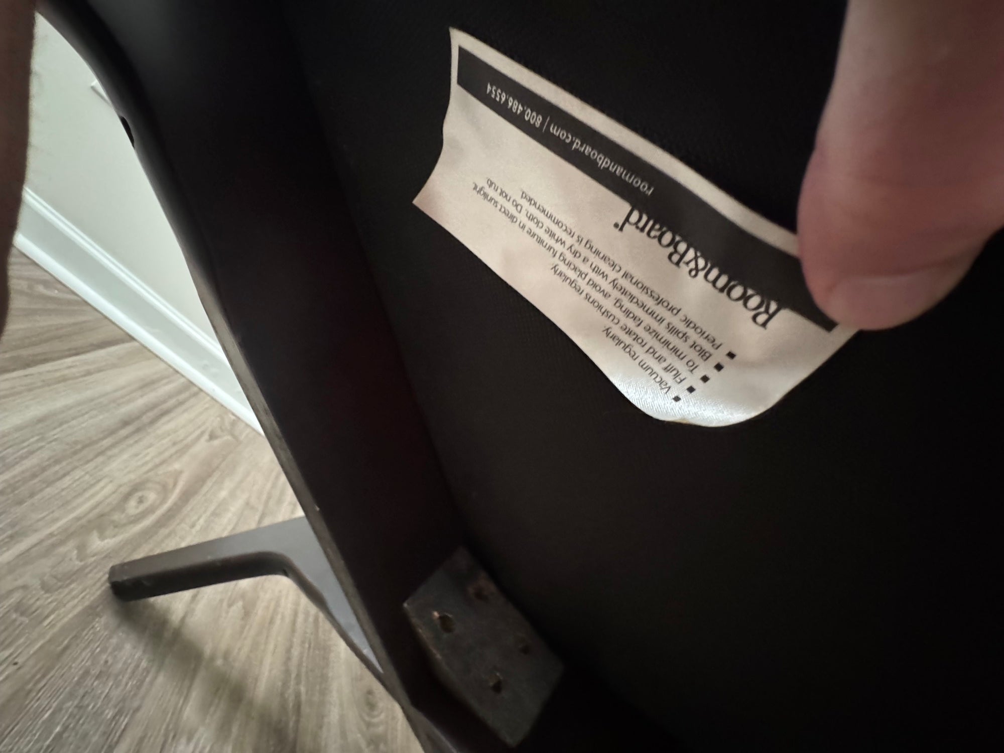 Measurement of seat width using yellow tape measure, showing approximately 30 inches