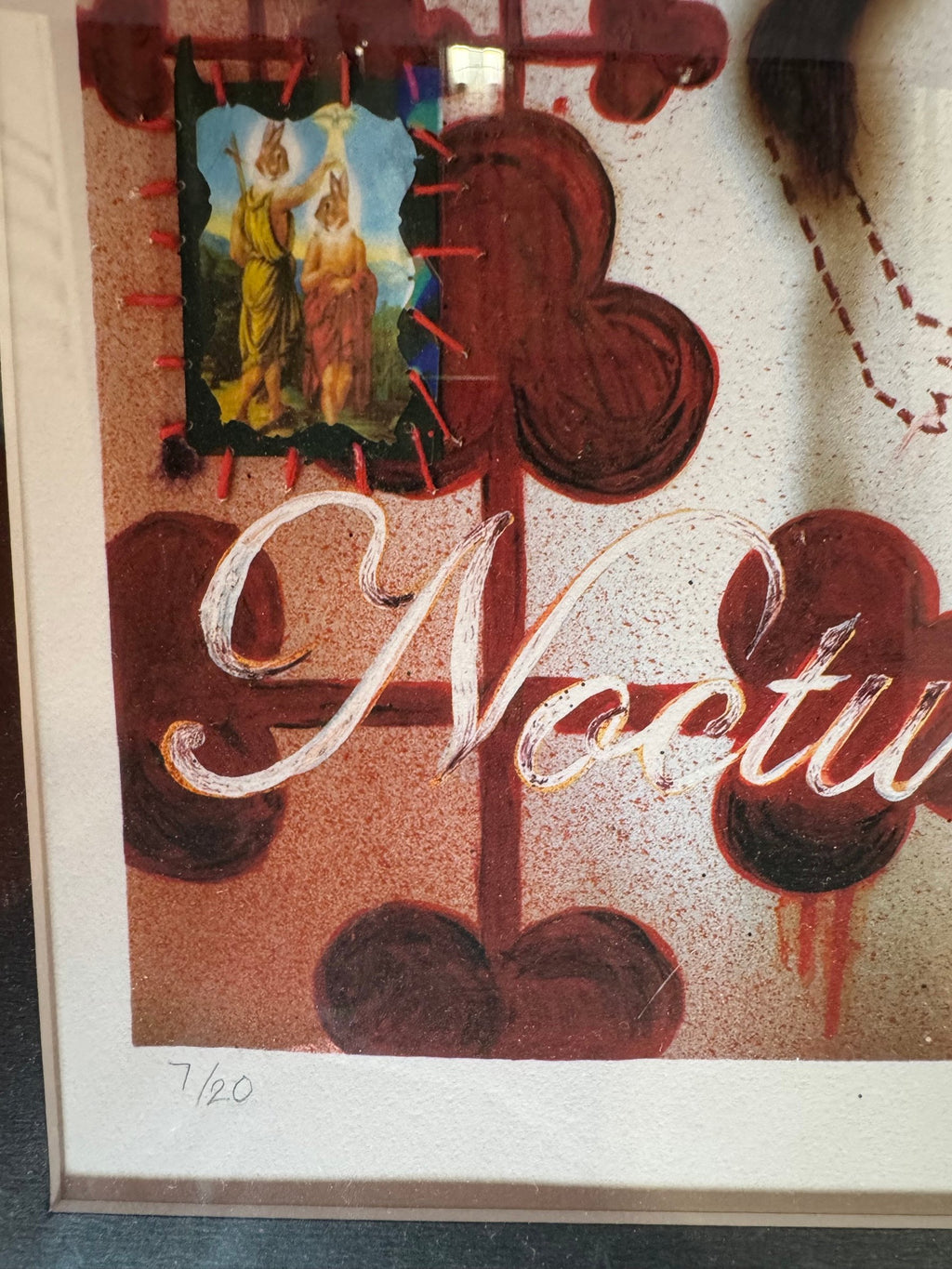 Close view of the lettering, inset image and 7/20 number
