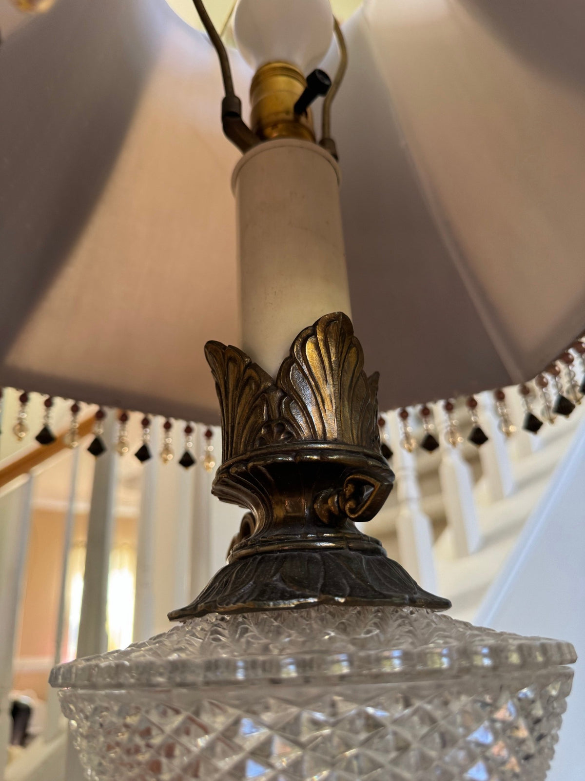 Cut-crystal font and metal socket cup under the shade