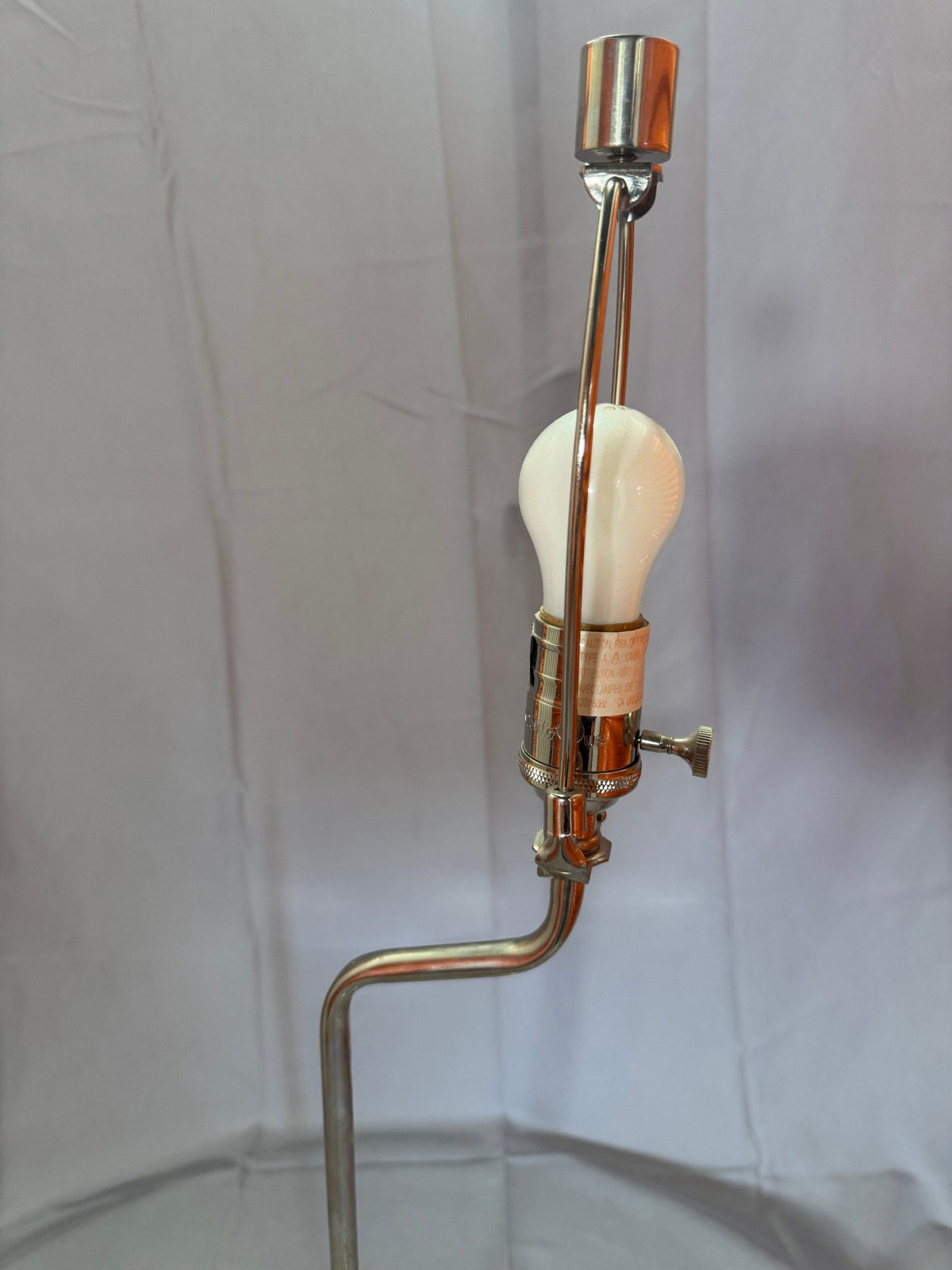 Close view of the chrome arm bend and socket area