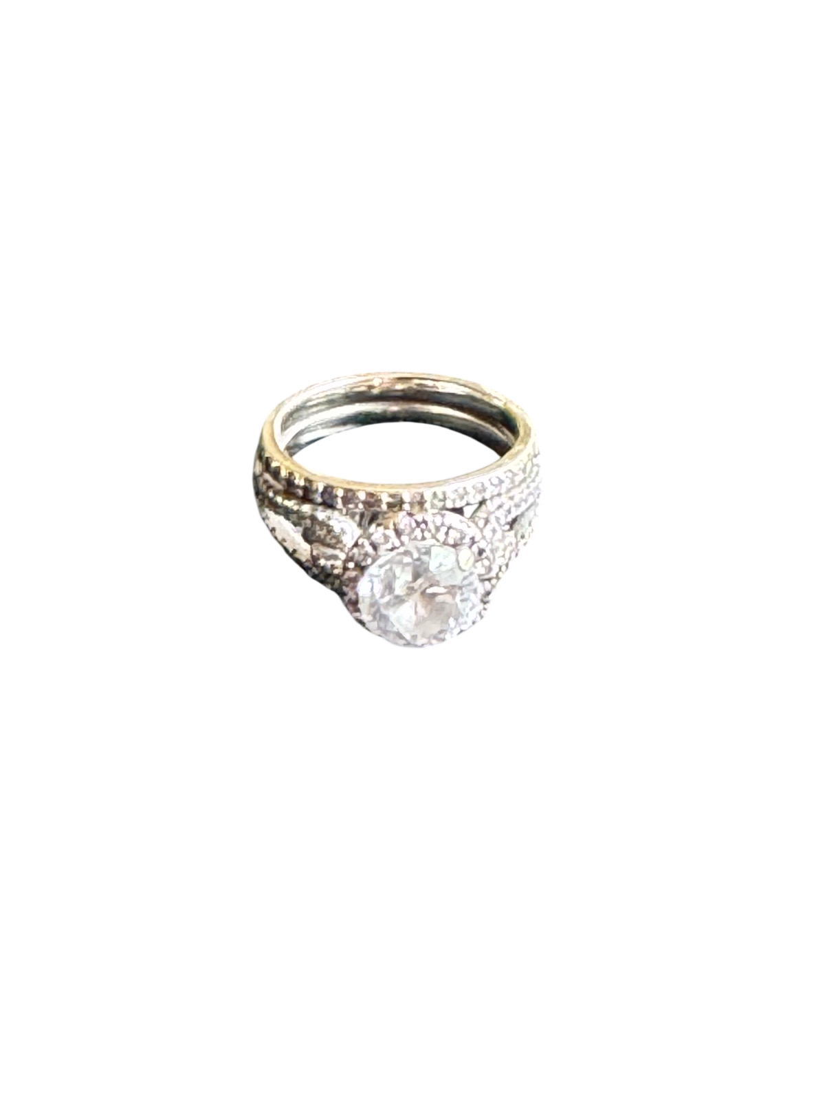 Natural diamond halo engagement ring with white gold band, angled three-quarter view against white background