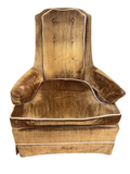 Gold velvet tufted armchair seen from the front