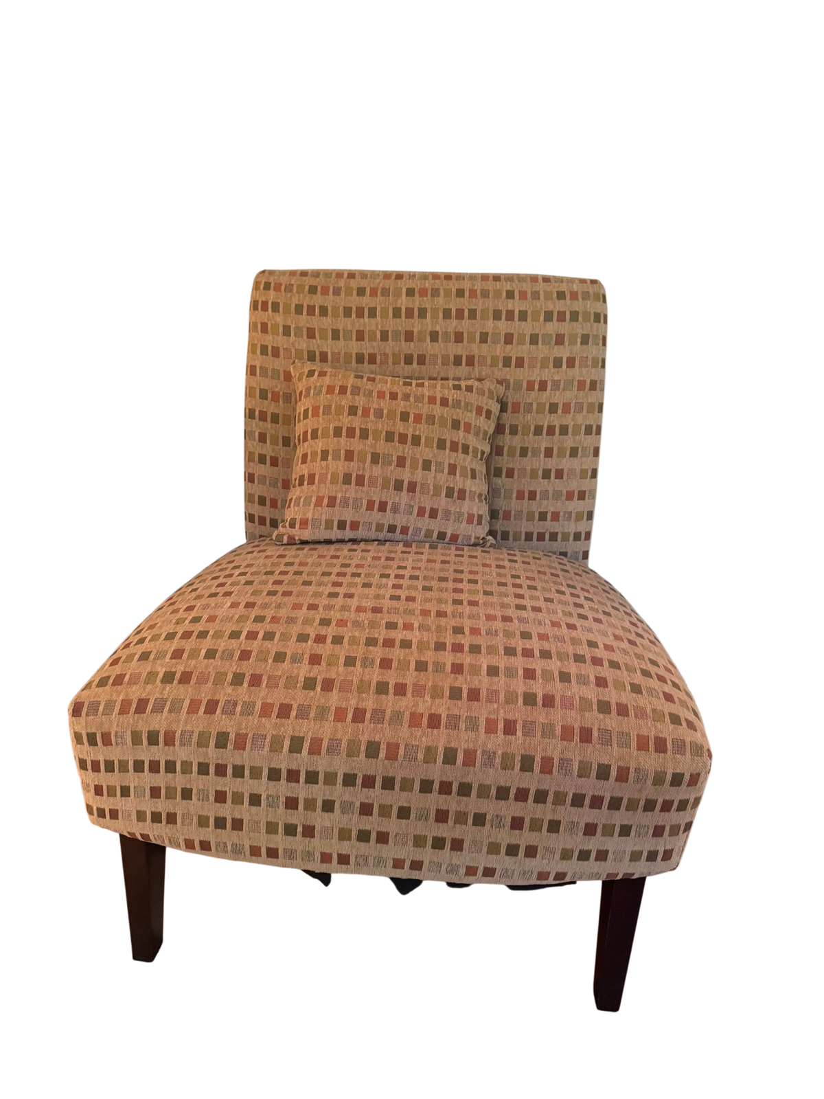 Tan, rust, and olive checkered armless accent chair with matching throw pillow and dark wood legs, shown in a living room corner.