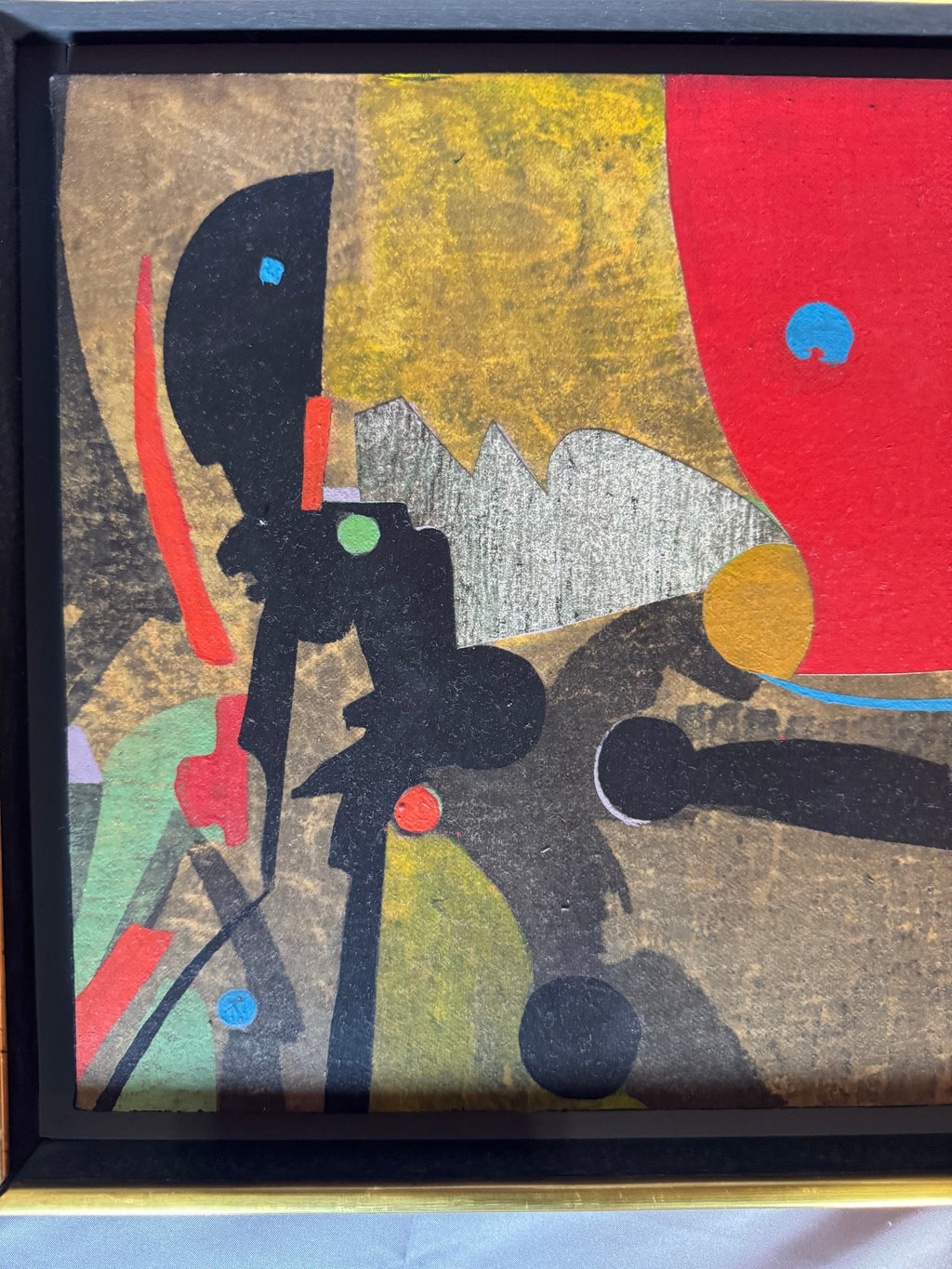 Detail of the black shapes and colored dots