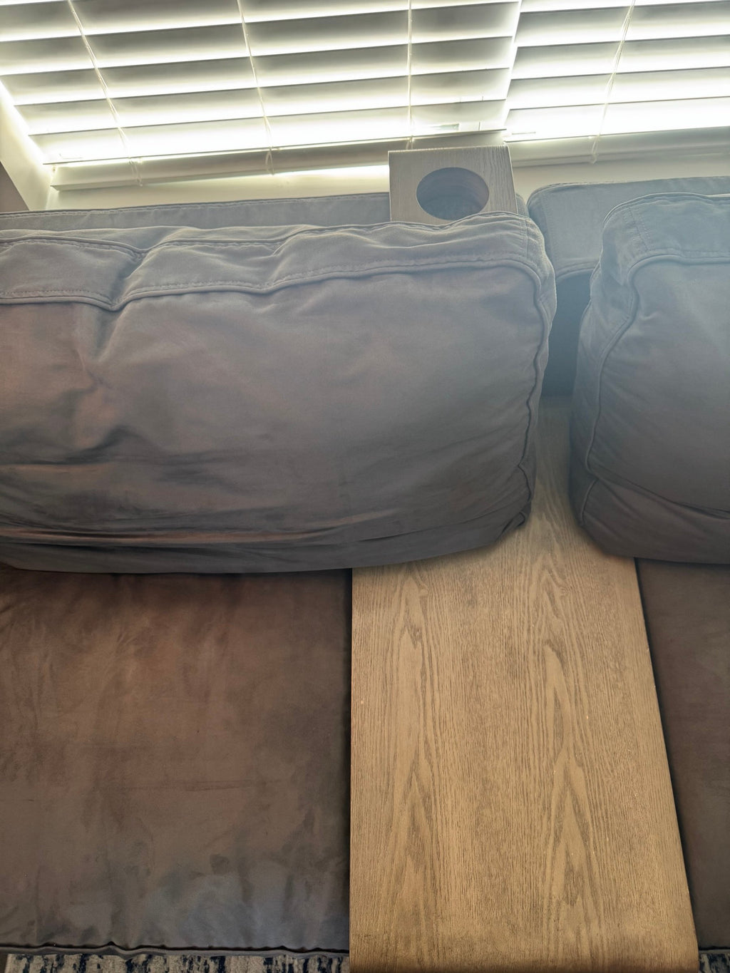 Wood drink-holder arm tray on the Lovesac Sactional
