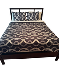 Espresso metal queen platform bed frame with slatted headboard, shown with bedding and pillows in a bedroom setting